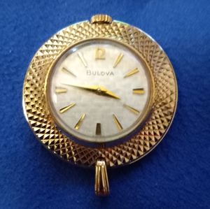 Vintage Bulova wind-up watch pendant.